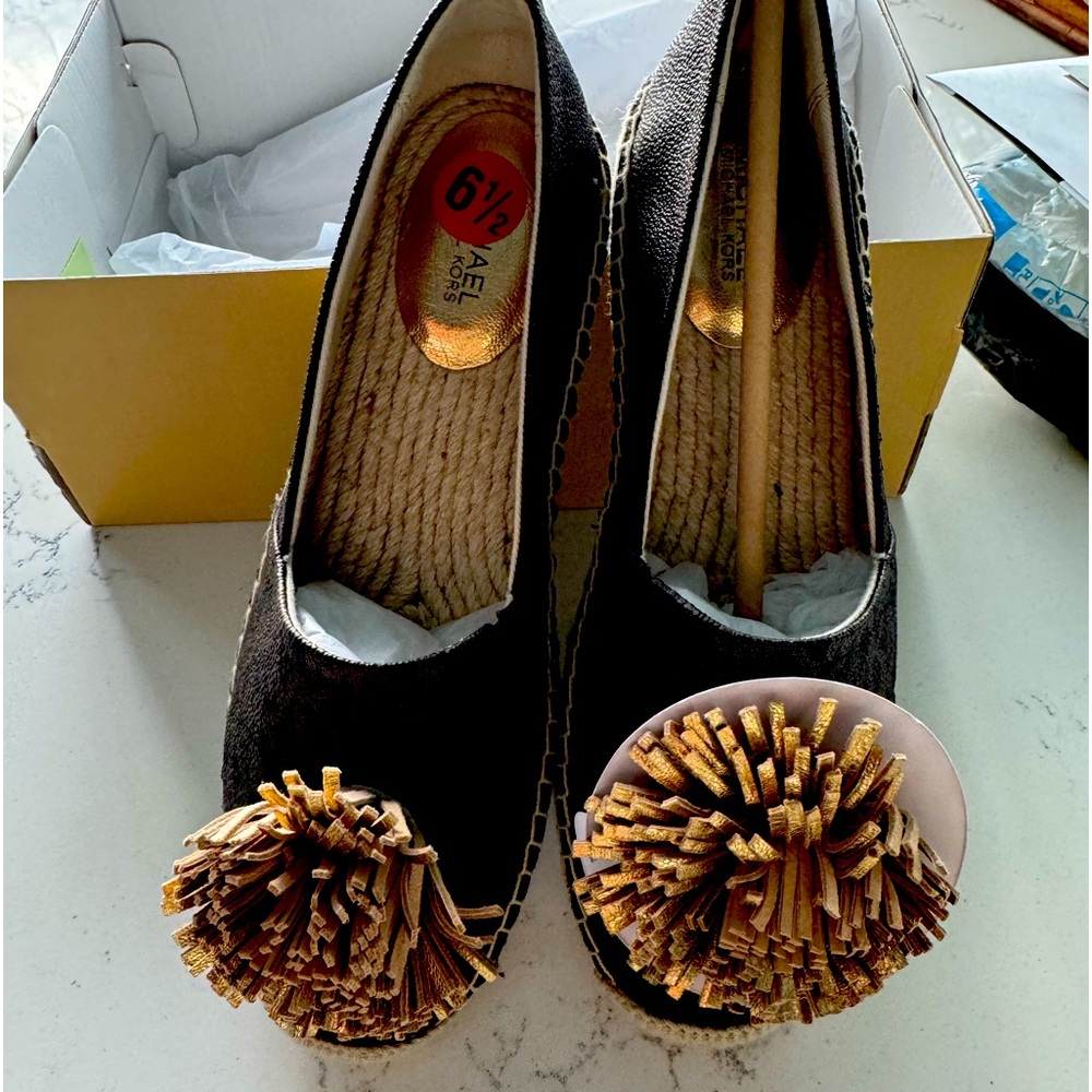 Michael Kors size 6 1/2 pom-pom shoes. New with box never worn.